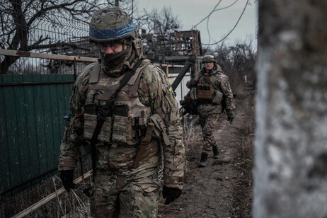 Ukrainian soldiers from the Volyn Detachment patrol the devastated town of Velyka Novosilka